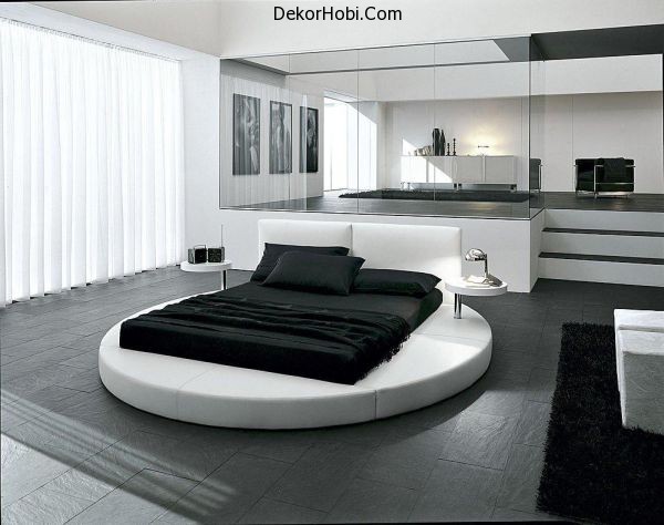 Sophisticated-contemporary-bedroom-with-ergonomic-round-bed-at-its-heart